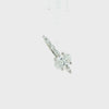 An oval diamond engagement ring with a brilliant center stone and marquise-cut side stones on a polished silver-colored band, set against a plain white background.