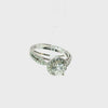 14K white gold halo engagement ring featuring a round brilliant-cut lab-grown center diamond, sparkling pavé diamond accents, and an elegant split-shank design, displayed on a clean white background.