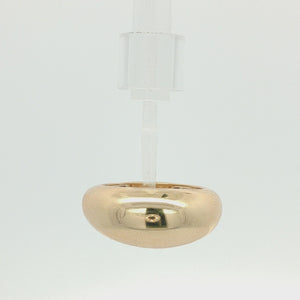 A polished, wide gold band ring with a smooth, rounded, dome-like shape, shown on a plain white background.
