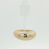 A polished, wide gold band ring with a smooth, rounded, dome-like shape, shown on a plain white background.