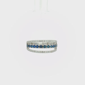 14K white gold open band ring featuring a vivid blue sapphire center row framed by two sparkling diamond rows.