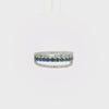 14K white gold open band ring featuring a vivid blue sapphire center row framed by two sparkling diamond rows.