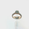 A diamond engagement ring and matching diamond wedding band shown on a white background. The ring features a round-cut diamond center stone in a prong setting with a rose gold and white gold band accented by pavé diamonds.