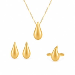 Gold teardrop-shaped jewelry set including necklace, earrings, and ring on a white background