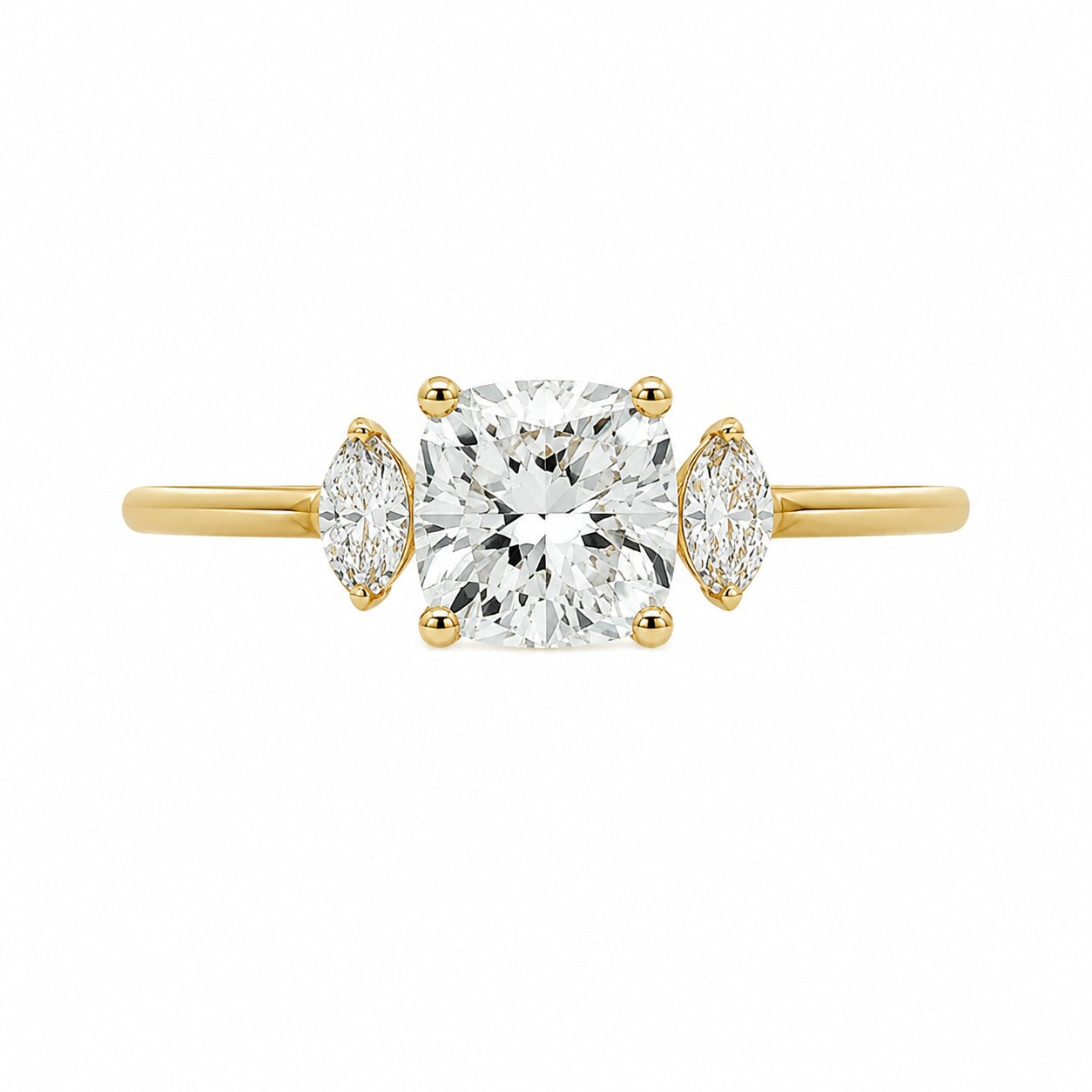 A yellow gold three-stone engagement ring featuring a large cushion-cut center diamond flanked by two marquise-cut side diamonds, set against a plain white background.