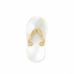 White flip-flop with gold toe strap on a white background
